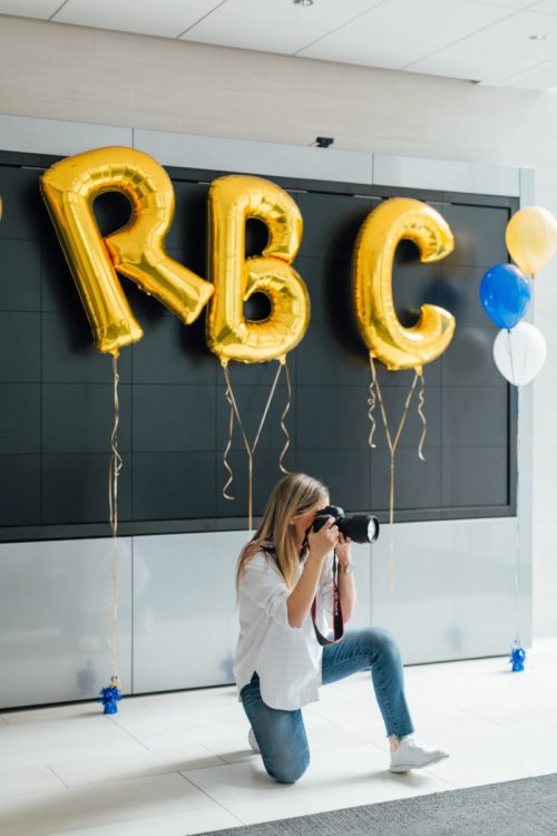 woman with camera and RBC balloons