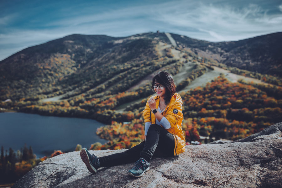 Girl on a rock for a landscape visual content shot