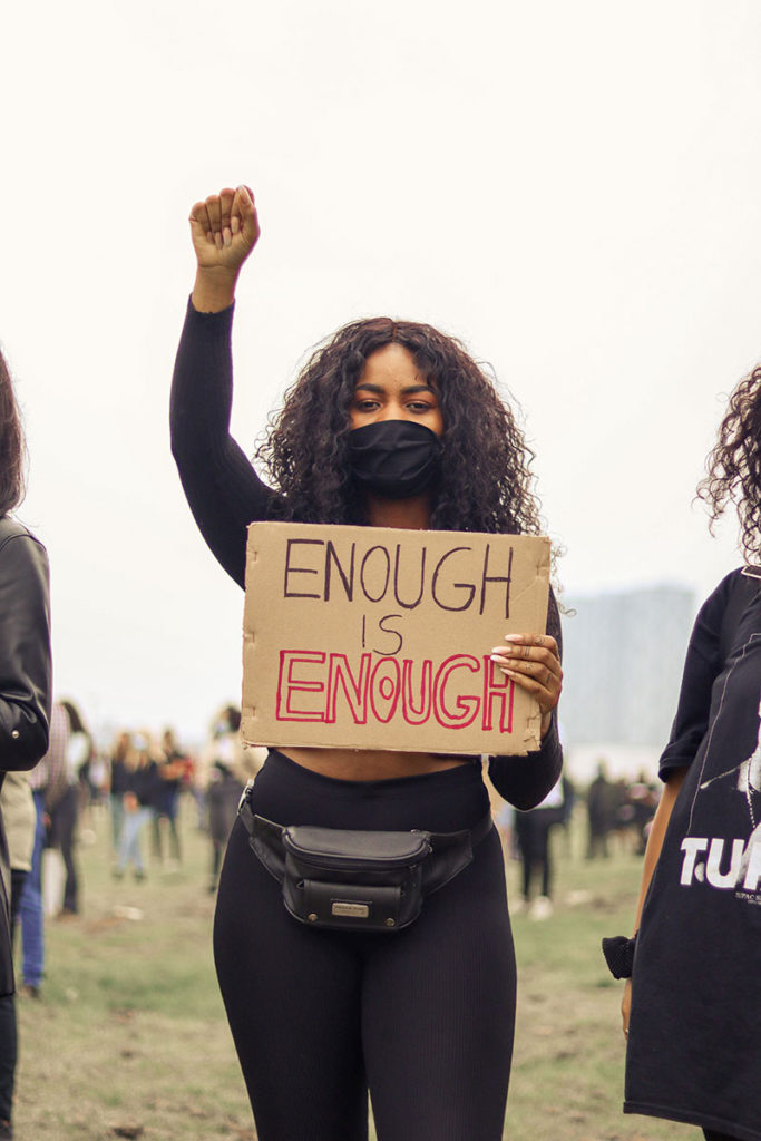 portrait protester holding a sign