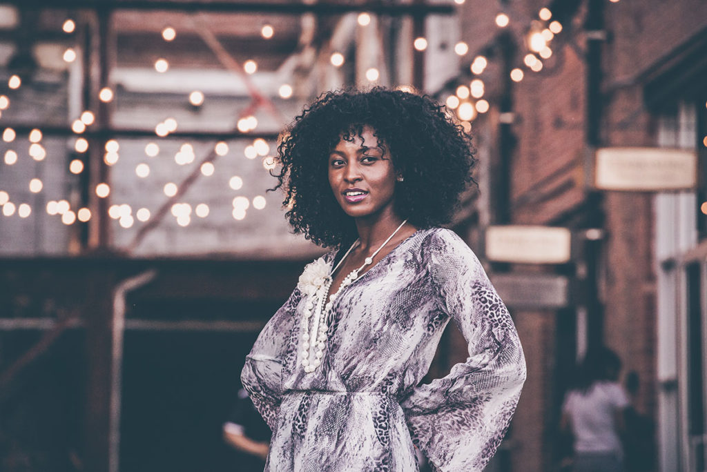 portrait woman with lights behind her