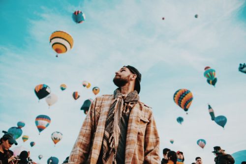 man at hot air balloon festival