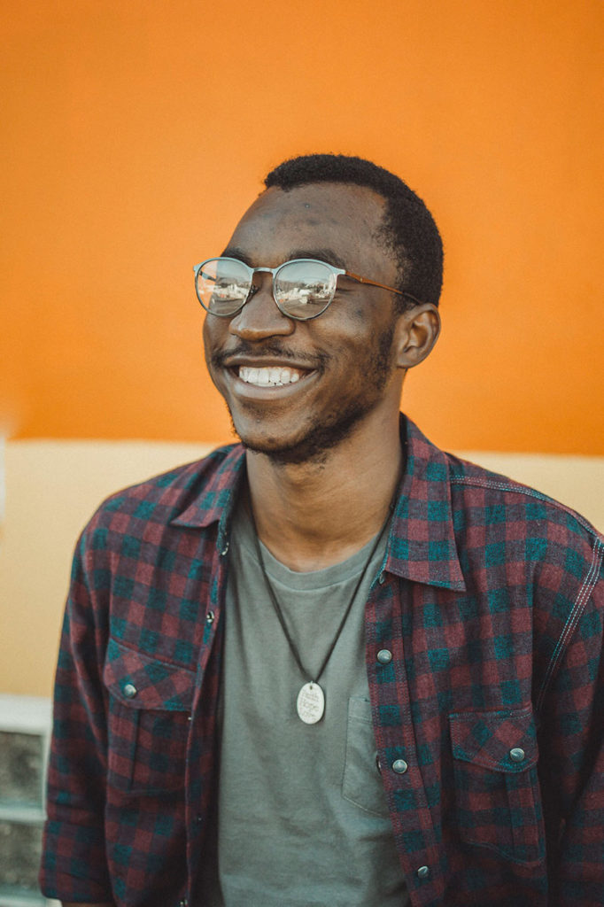 portrait guy smiling with glasses