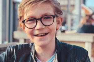 Young man with glasses and a smile